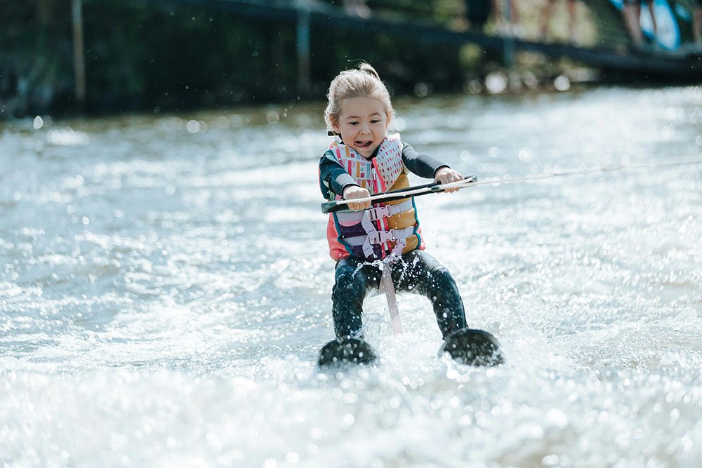A child water skiing on a Flathead Valley lake in summer